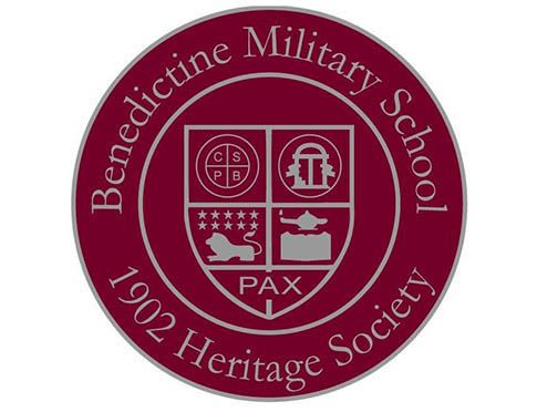 Maroon Heritage Society seal with shield featuring PAX motto, lion, and tower symbols