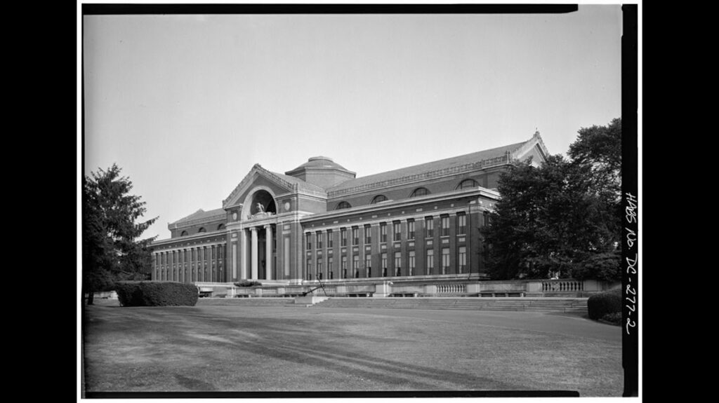 Historic black and white photo of Roosevelt Hall with grand columned entrance and brick facade