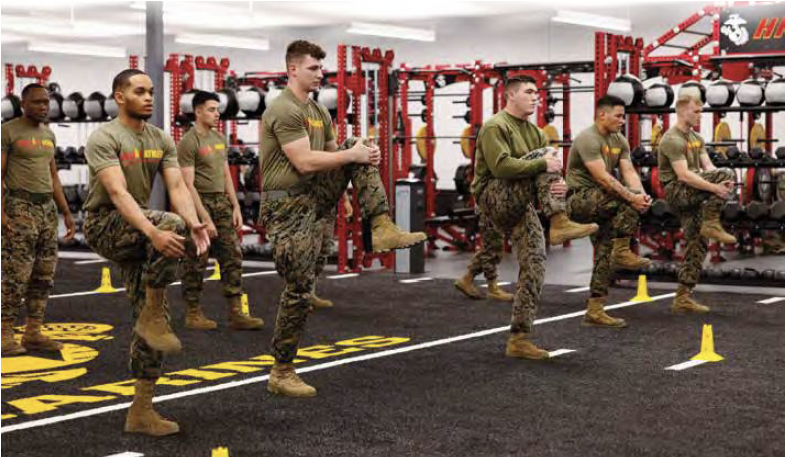 Marines performing lunge exercises in HITT fitness center with red weight equipment