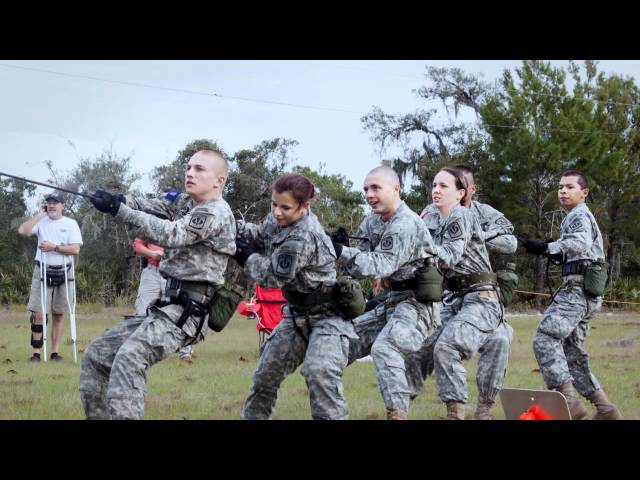 Cadets in ACU uniforms competing in tug-of-war during Raiders physical training event